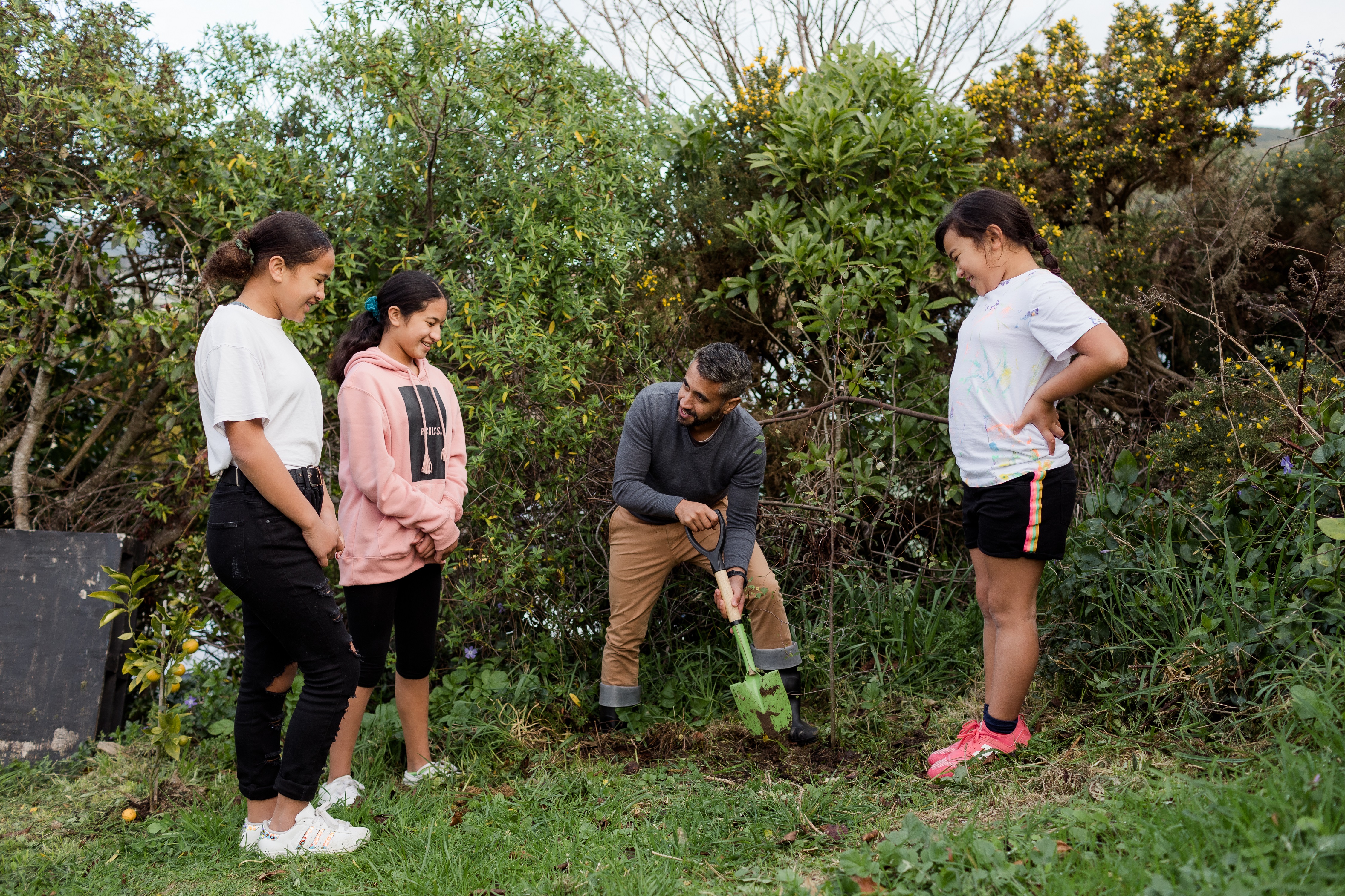 whanau digging a garden