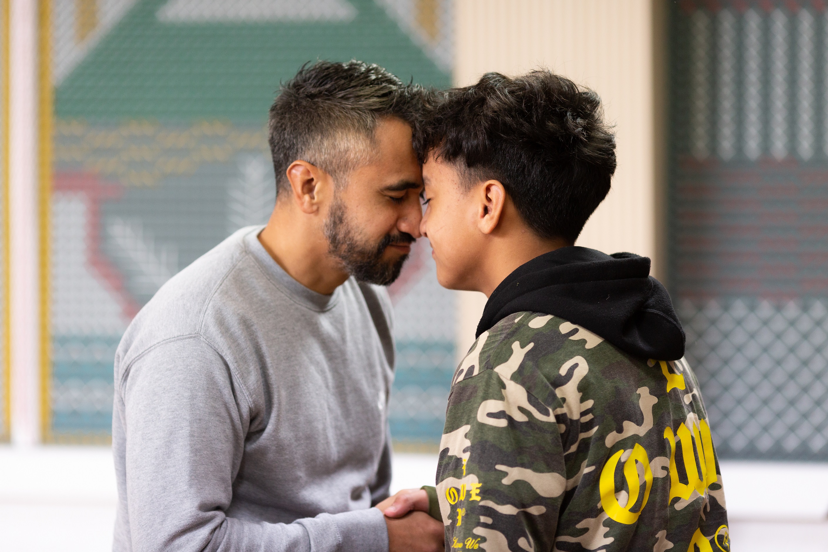 Teen and his social worker hongi