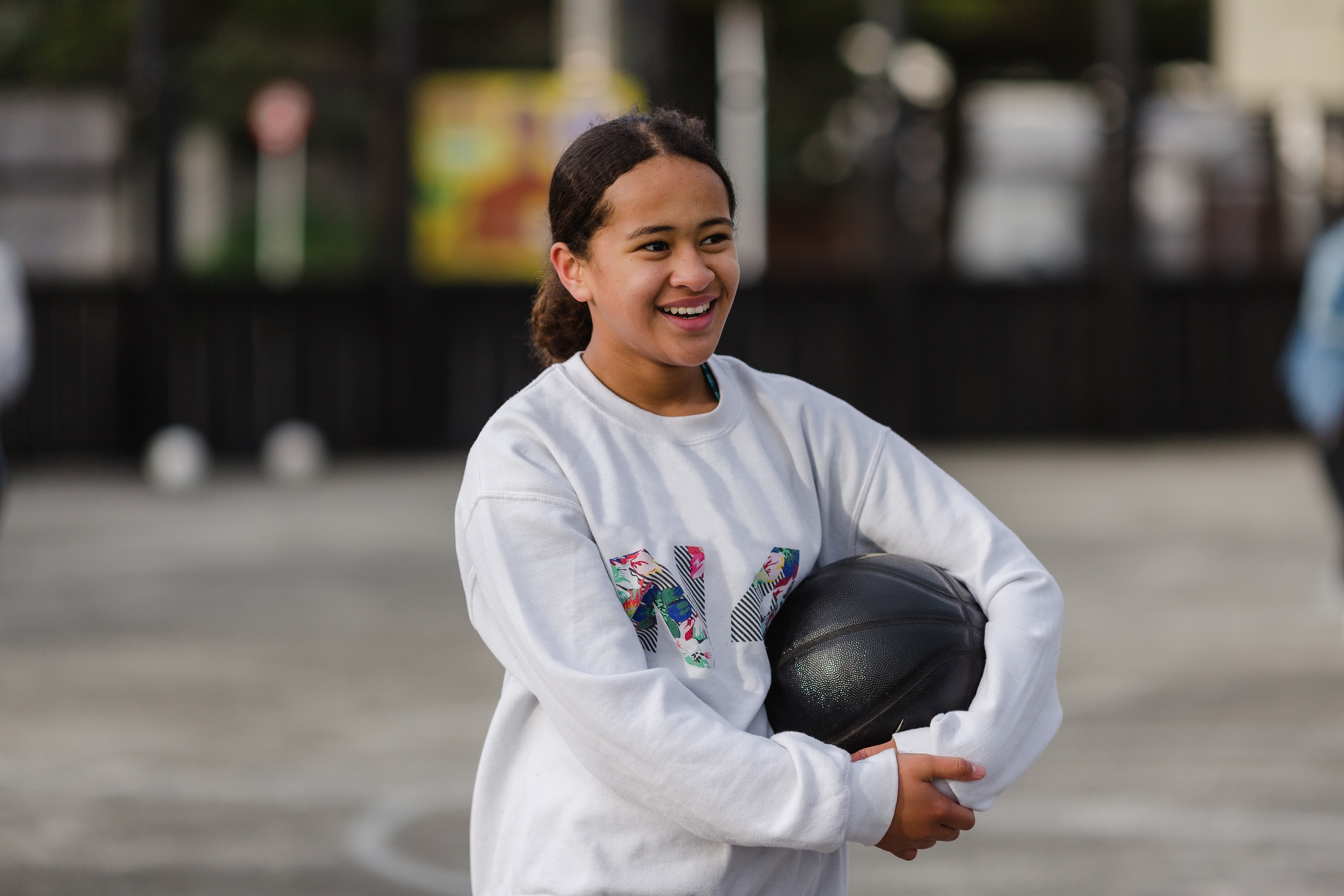 teen girl with basketball